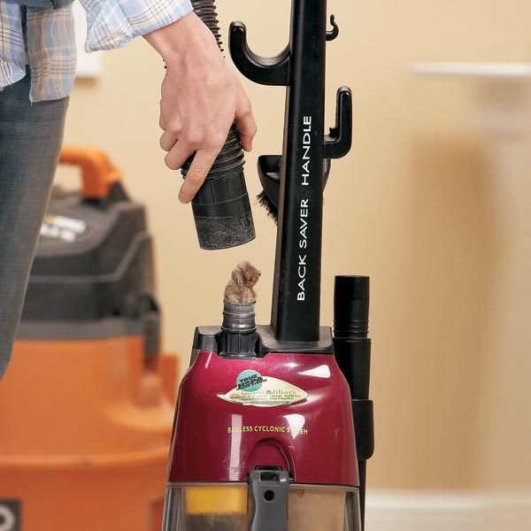 How do you clear a clog in a vacuum?