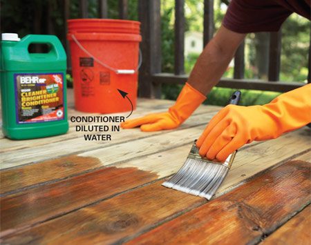 How do you remove solid stains from a wood deck?