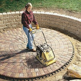Run the plate compactor on top of the pavers