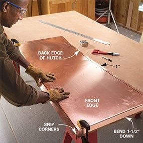 Step 15: Center the 24-in. wide copper sheet over the cabinet top with a 1-1/2 in. overhang in front