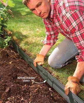 how to edge a lawn - man installing landscape border in trench