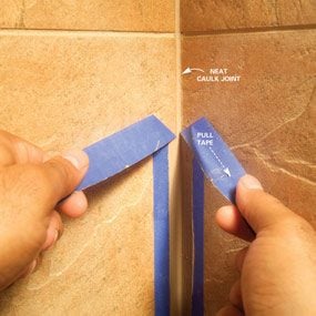 Pulling tape off the tile