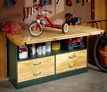 Fold-up garage workbench with top in up position