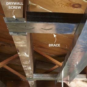 Track sections span joist spaces to support ceiling plate