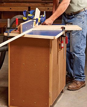 Cutting a long workpiece on a router table.