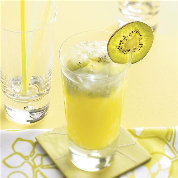Sparkling kiwi lemonade in a frosty glass with a slice of kiwi as a decoration on the rim