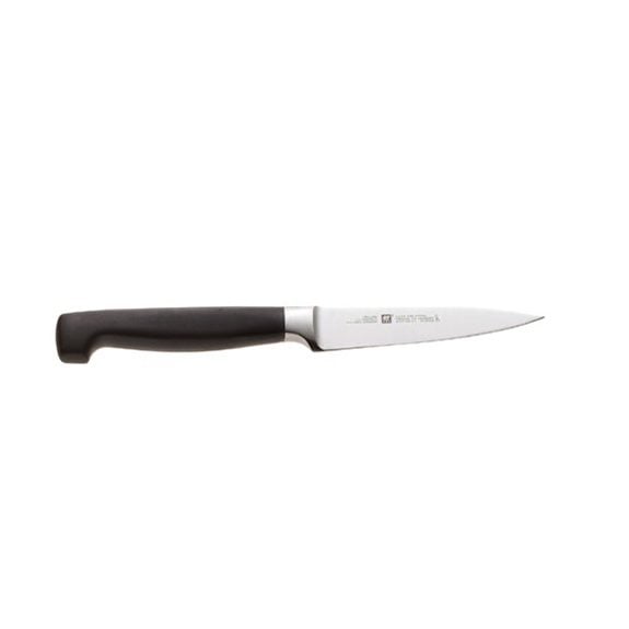 Black-handled, 4-inch paring knife on a white background