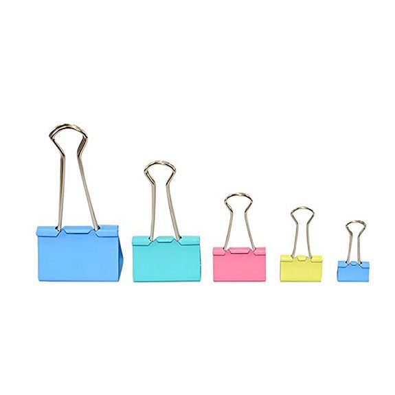 Line up of paper clips from biggest to small and in varying pastel colors