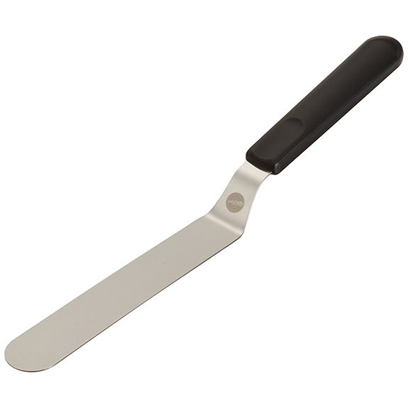 Black-handled, angled icing spatula on a white background