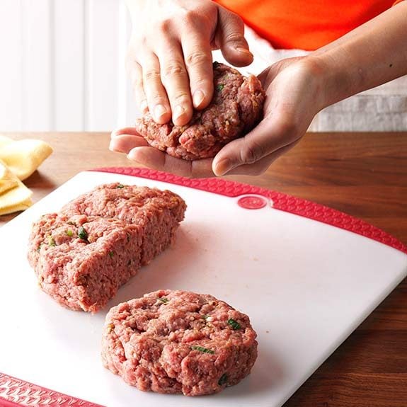 Homemade burger patties being shaped properly