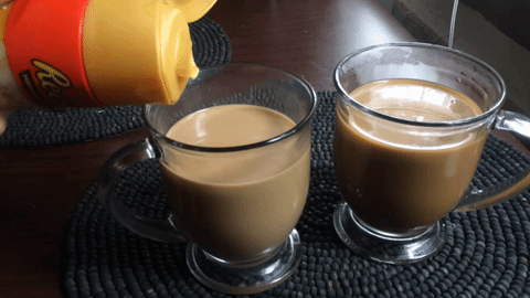 Reese's International Delight creamer being pouring into a glass of coffee in an endless loop