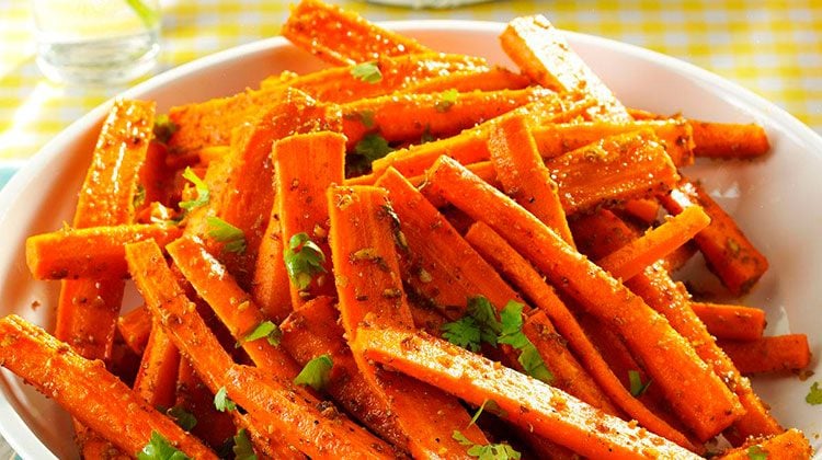 cooked and spiced carrots piled together on a plate